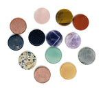 Round gemstone slab and cabochon in mixed colors, featuring flat, polished crystal coins and loose gemstones by GemstoneGO.