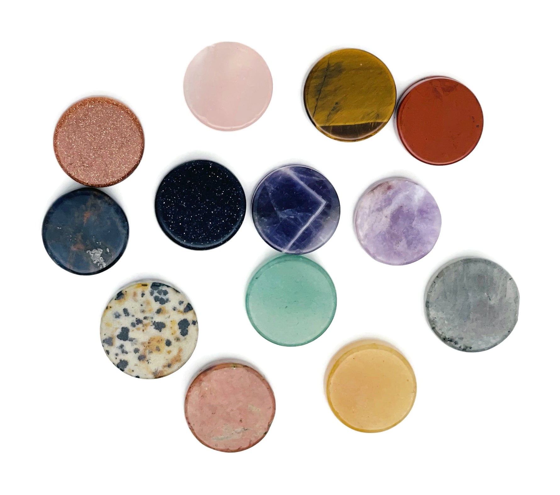 Round gemstone slab and cabochon in mixed colors, featuring flat, polished crystal coins and loose gemstones by GemstoneGO.