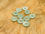 A 20mm aventurine crystal donut pendant with natural green gemstone, showcasing its polished, smooth, circular shape and vibrant color.