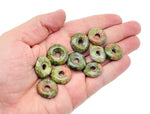 Unakite crystal donut pendant, 20mm Pi stone from GemstoneGO, showcasing vibrant green and pink mineral patterns.