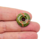 Unakite crystal donut pendant, 20mm Pi stone from GemstoneGO, showcasing vibrant green and pink mineral patterns.
