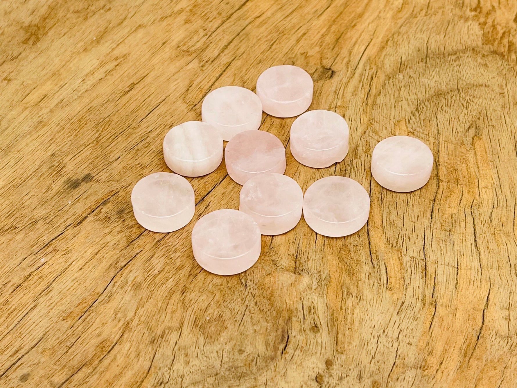 Round rose quartz flat gemstone slab from GemstoneGO, showcasing a smooth, polished pink crystal surface for jewelry or decor.