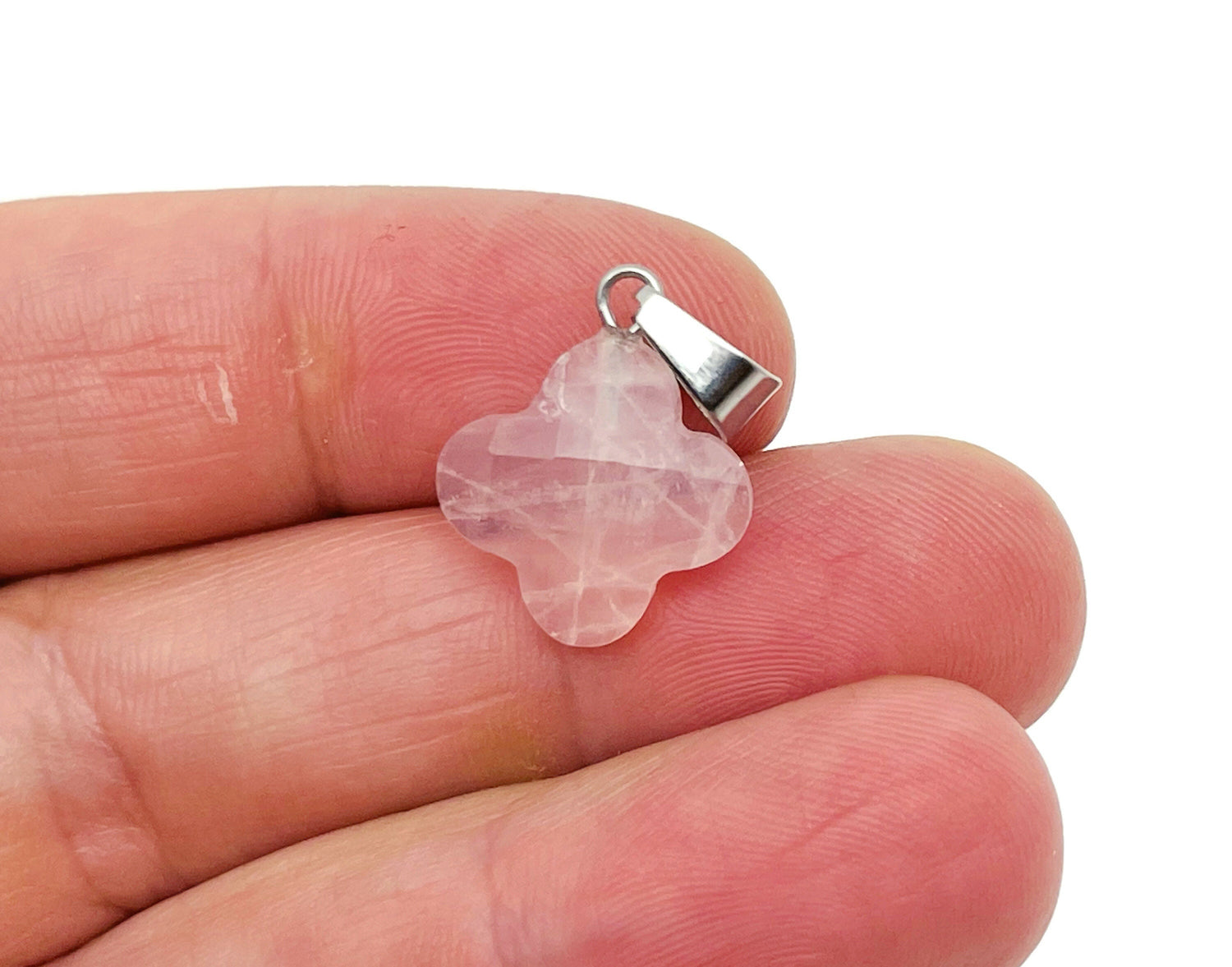 Rose quartz four-leaf clover crystal pendant from GemstoneGO, ideal for DIY jewelry making, showcasing a delicate pink gemstone charm.