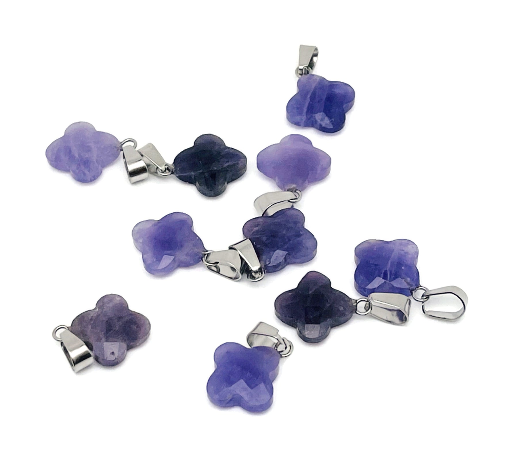 Amethyst four-leaf clover crystal pendant from GemstoneGO, ideal for DIY jewelry making, featuring a purple gemstone charm.