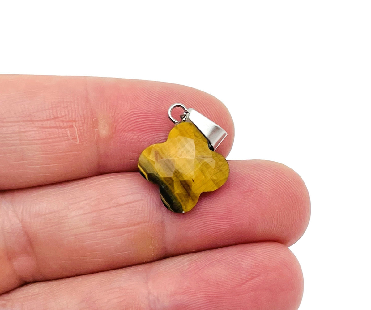 Tiger Eye four-leaf clover crystal pendant for DIY jewelry making, showcasing a polished gemstone with a silver bail.