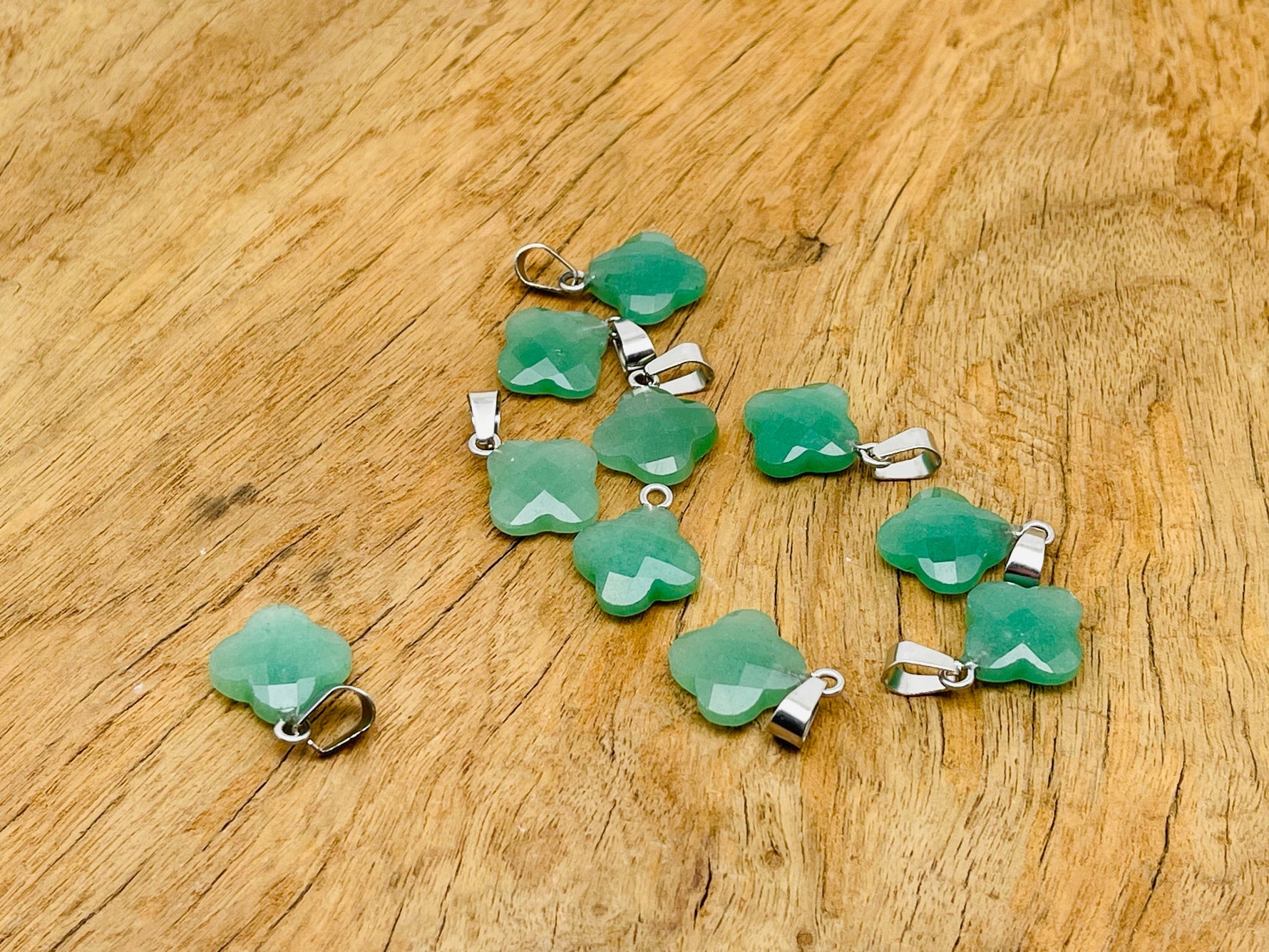 Aventurine four-leaf clover crystal pendant from GemstoneGO, ideal for DIY jewelry making, featuring green aventurine and sparkling crystal.