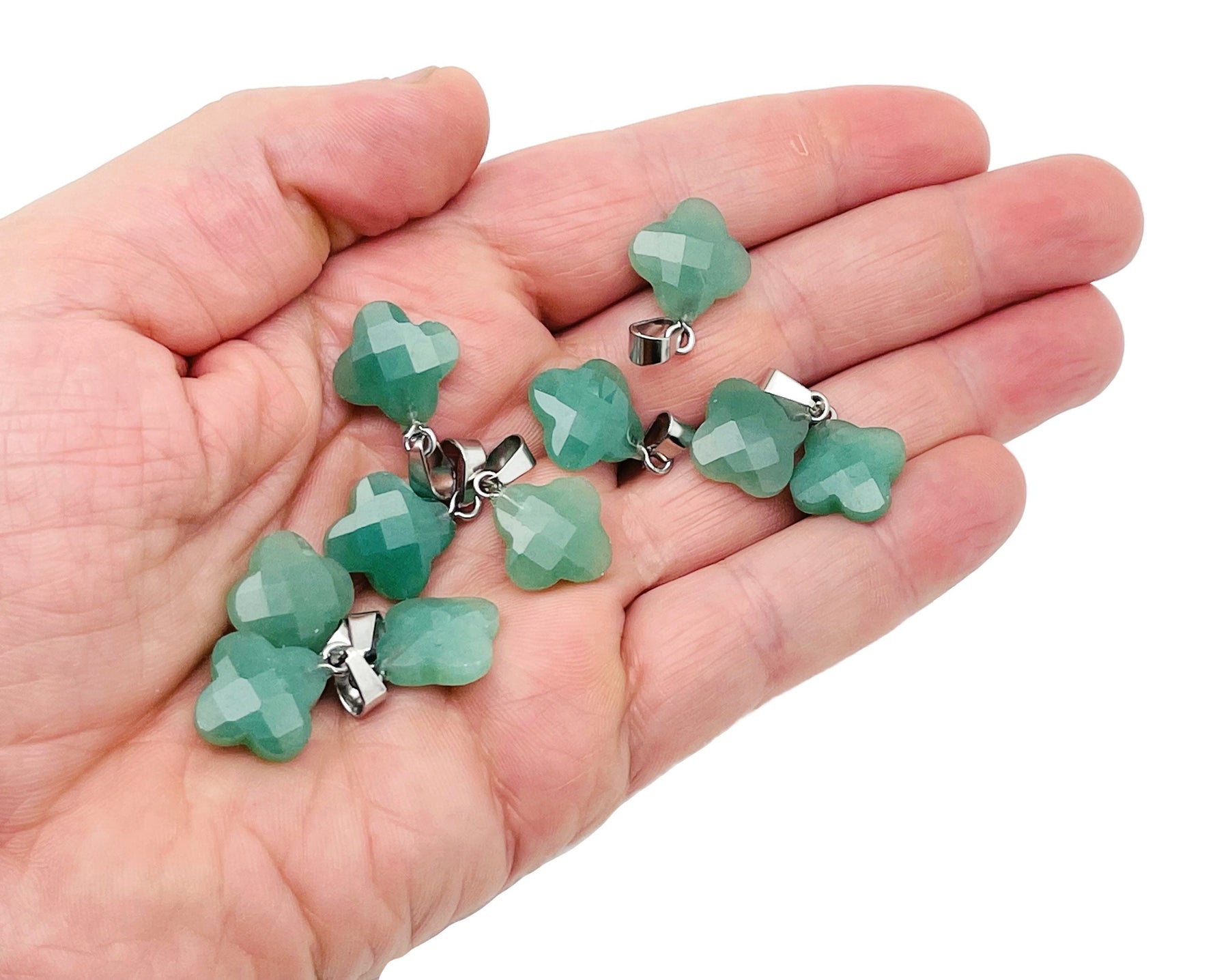 Aventurine four-leaf clover crystal pendant from GemstoneGO, perfect for DIY jewelry making, shown against a neutral background.