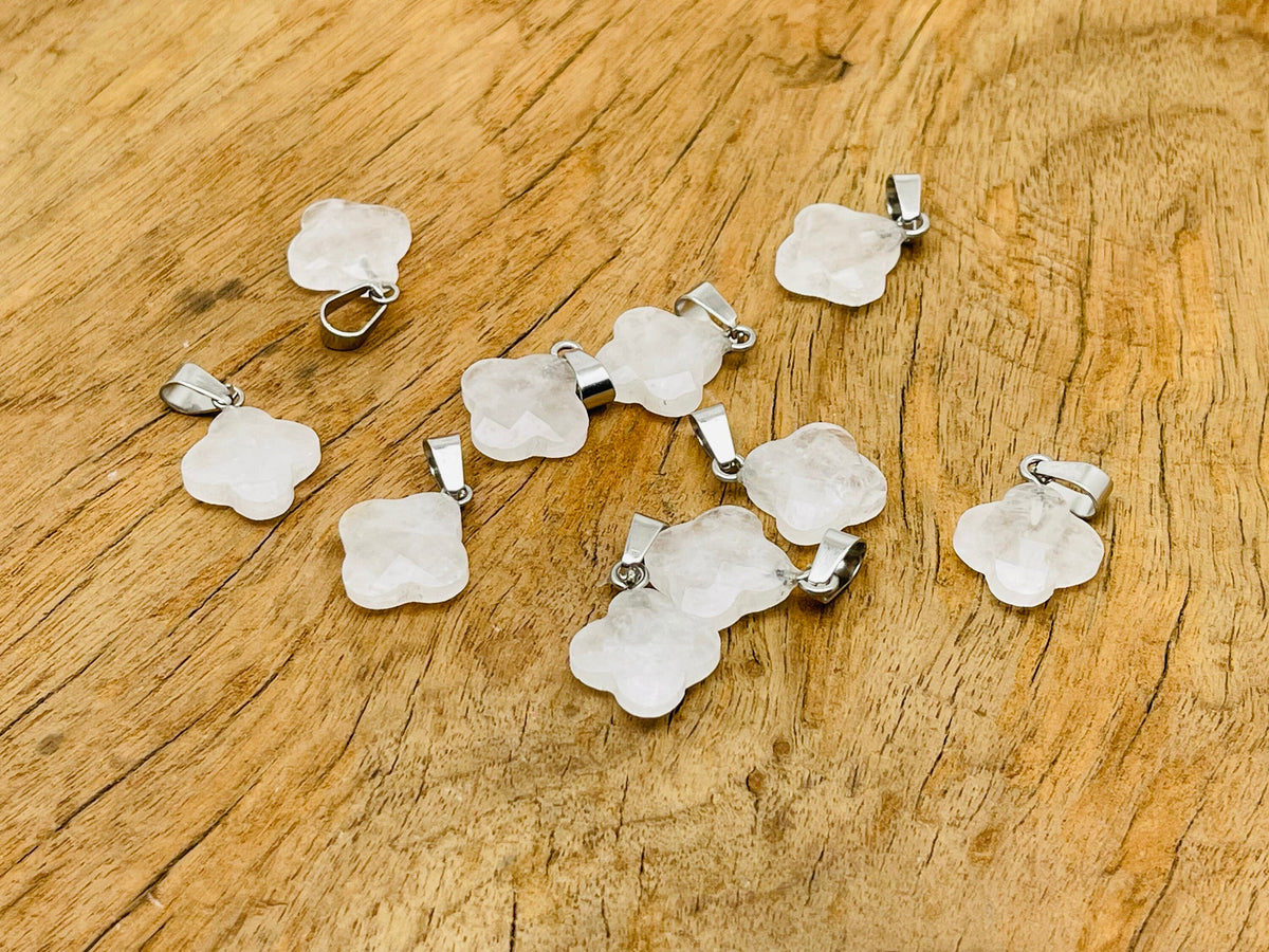 Clear quartz four-leaf clover crystal pendant from GemstoneGO, showcasing a sparkling DIY jewelry-making supply with a silver bail.