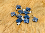 Sodalite four-leaf clover crystal pendant from GemstoneGO, ideal for DIY jewelry making, featuring blue and white stone details.