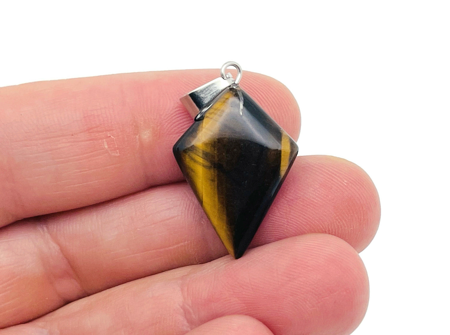 Tiger Eye triangle gemstone pendant featuring a geometric design, crafted by GemstoneGO. Natural stone with warm earthy tones.