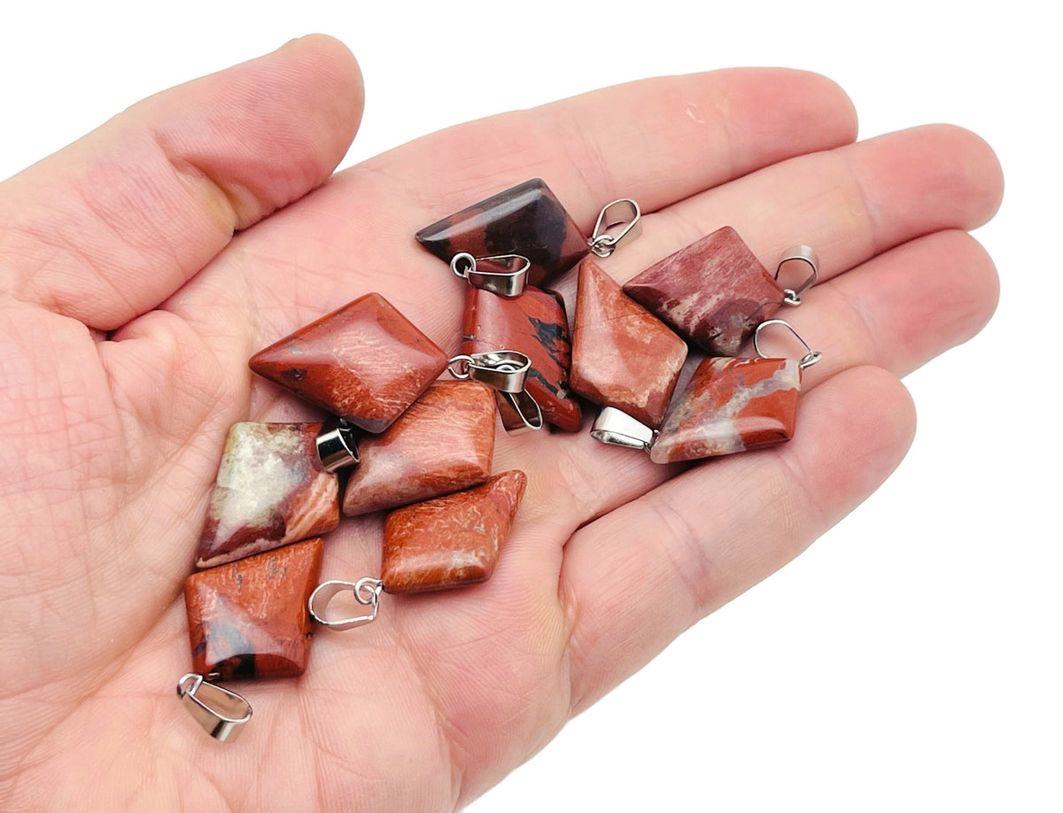 Red Jasper triangle gemstone pendant from GemstoneGO featuring a geometric design and polished finish.