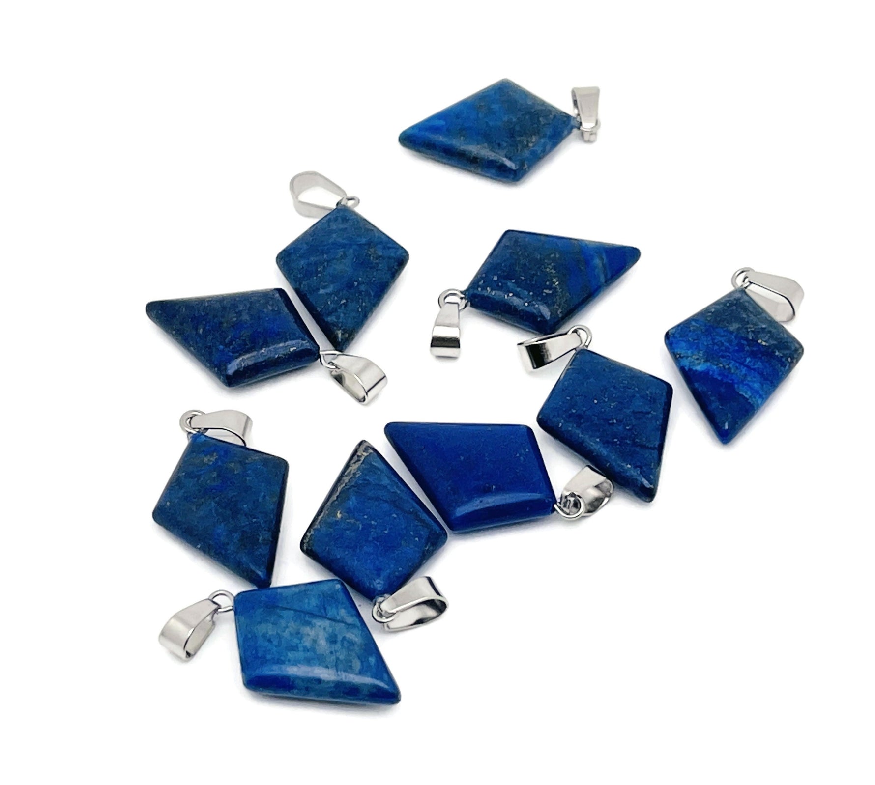 Lapis Lazuli triangle gemstone pendant with geometric design, featuring deep blue and gold flecks, on a silver chain.