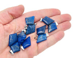 Lapis Lazuli triangle gemstone pendant with geometric design, showcasing deep blue stone with gold flecks, by GemstoneGO.