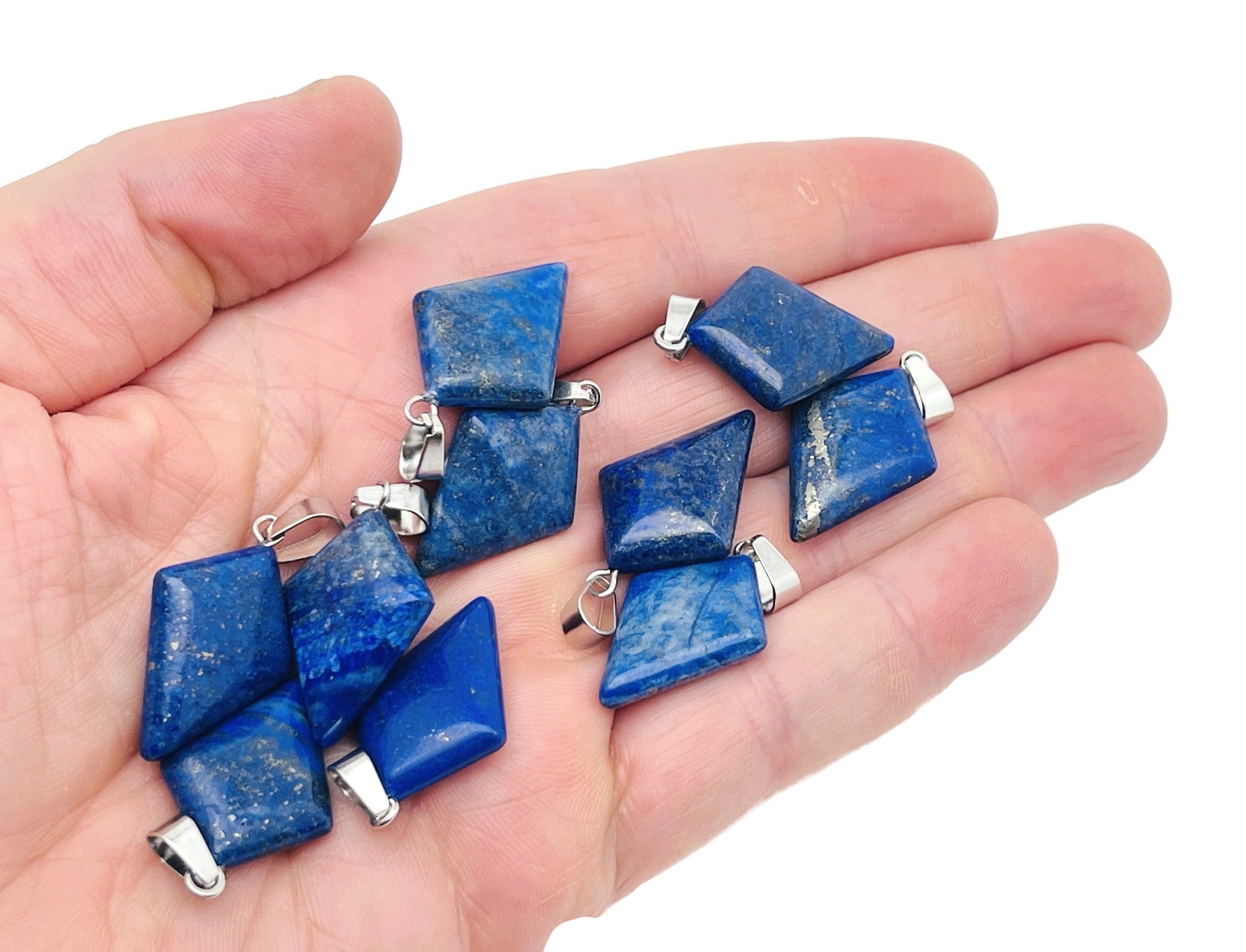 Lapis Lazuli triangle gemstone pendant with geometric design, showcasing deep blue stone with gold flecks, by GemstoneGO.