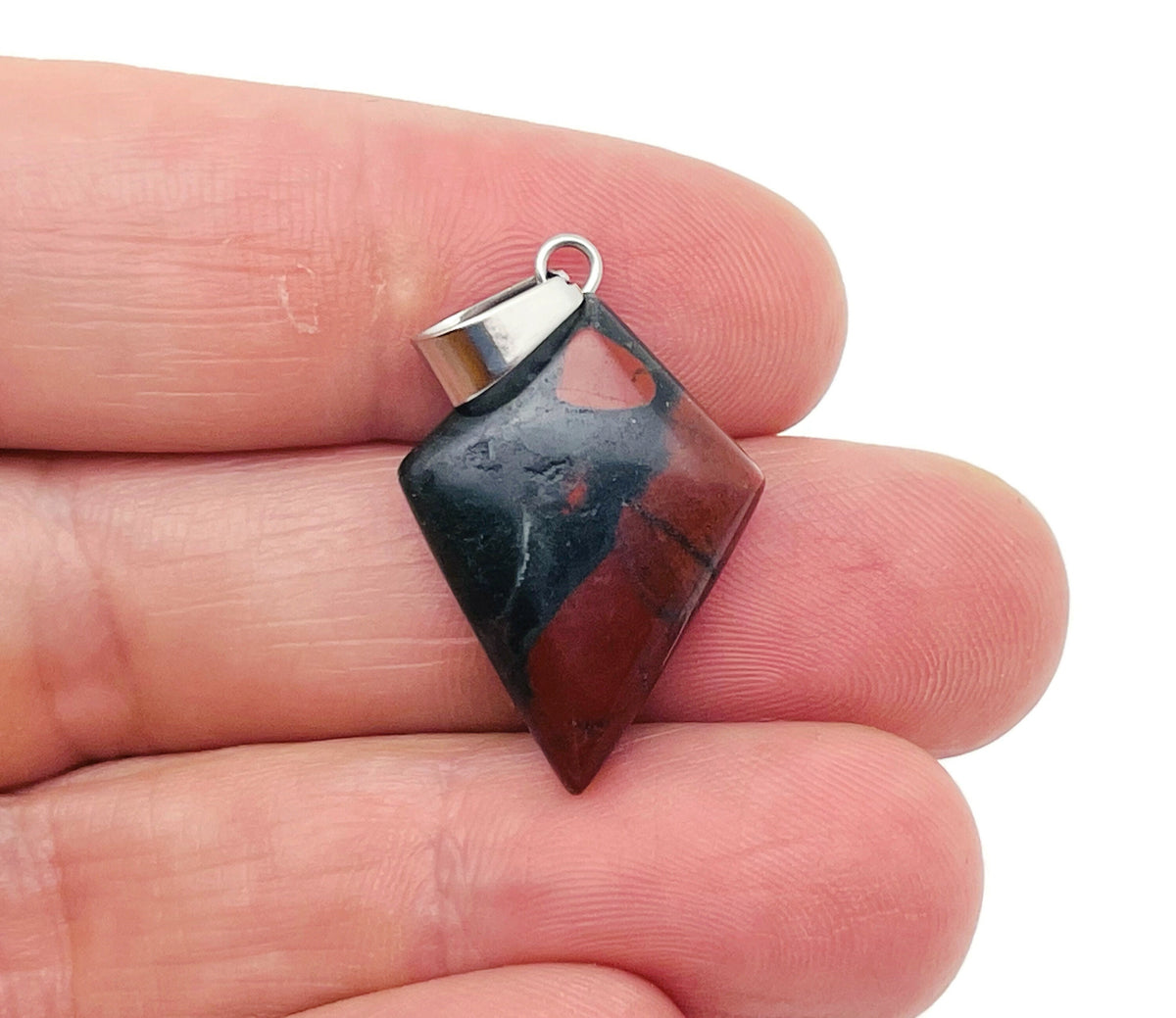 African Bloodstone triangle gemstone pendant featuring a geometric design, showcasing deep green stone with red flecks.