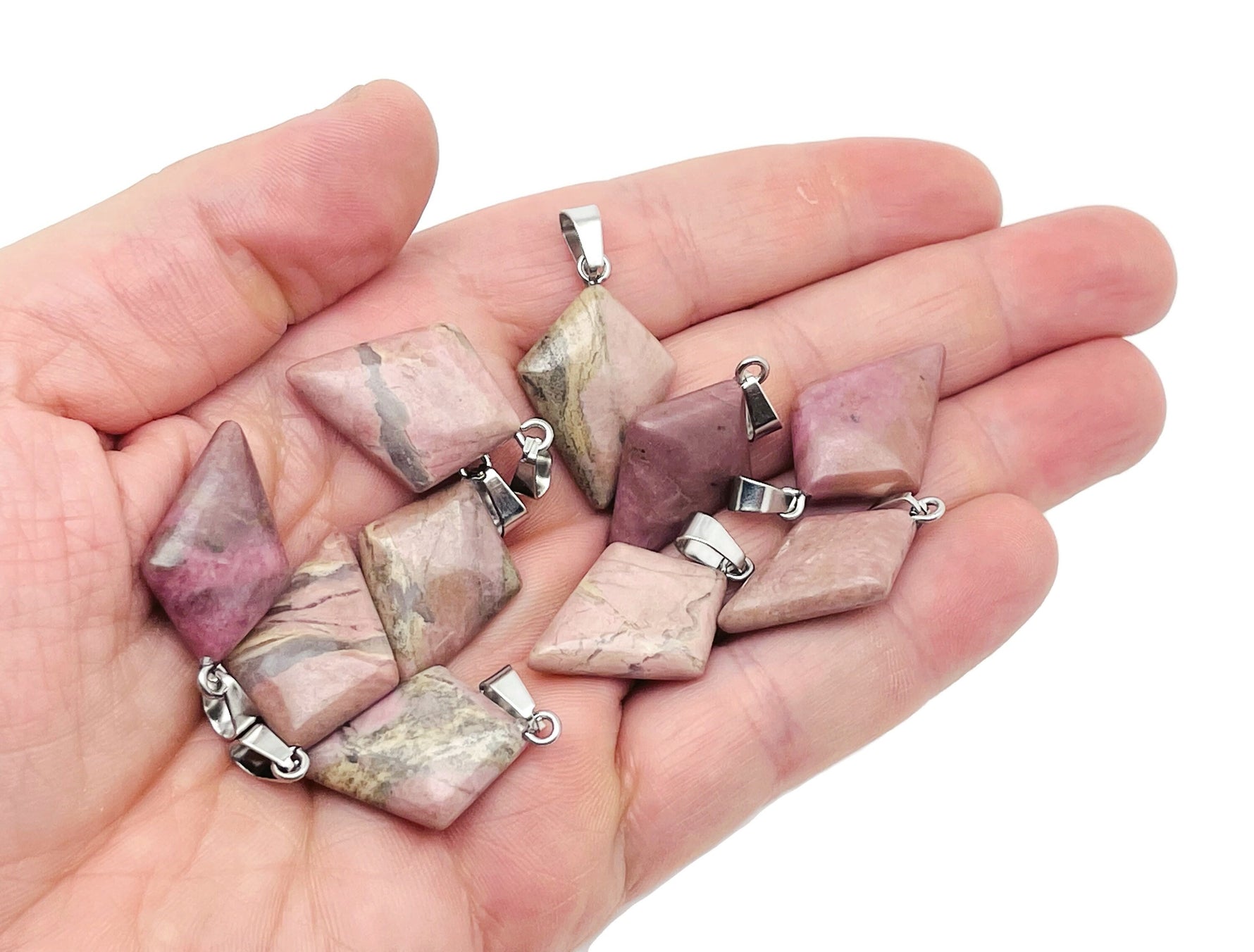 Rhodonite triangle gemstone pendant from GemstoneGO featuring a geometric design and polished finish on a silver chain.