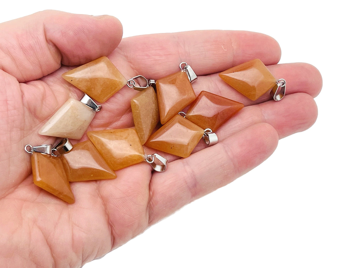 Orange aventurine triangle gemstone pendant from GemstoneGO, featuring a geometric design and polished finish.