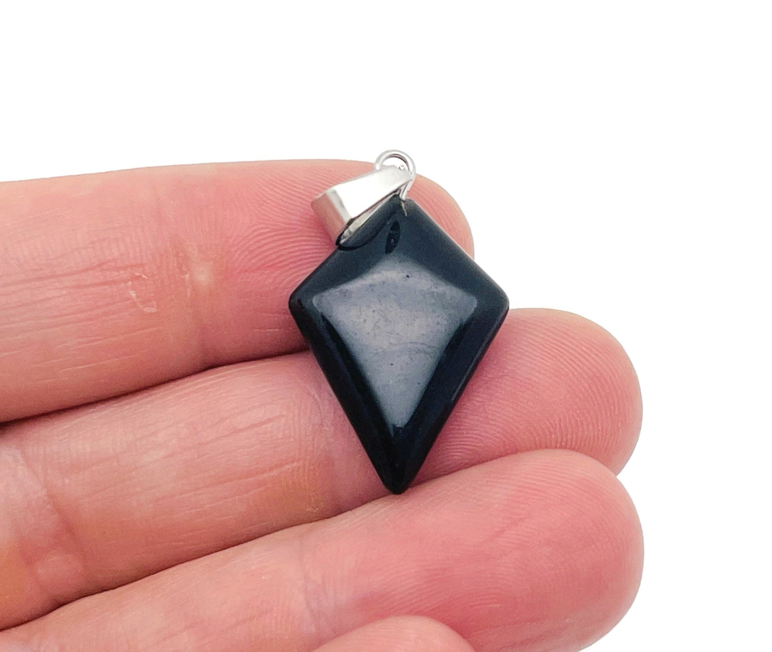 Obsidian triangle gemstone pendant with geometric design from GemstoneGO, showcasing a polished black stone pendant.
