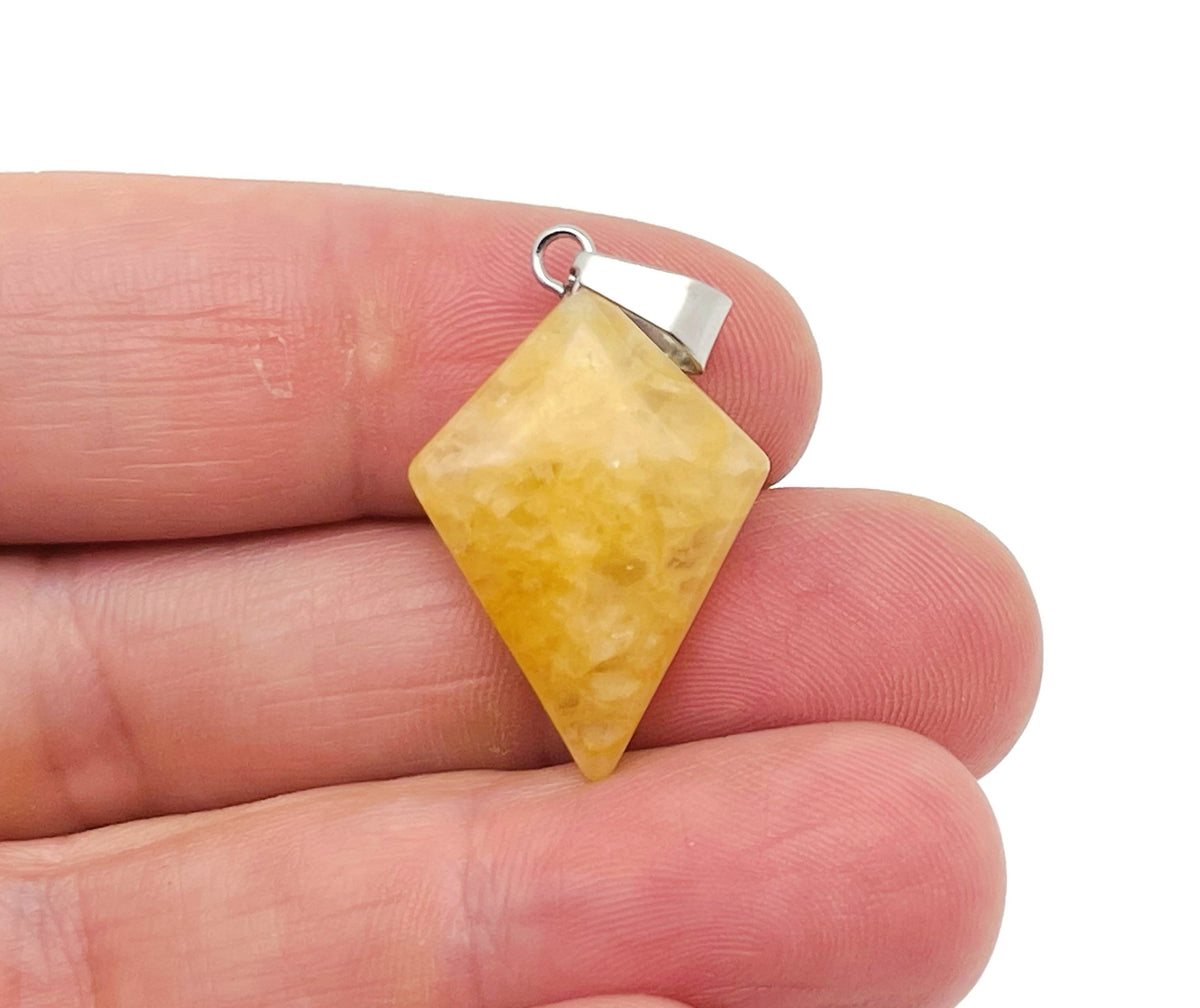 Yellow jade triangle gemstone pendant featuring a geometric design, crafted by GemstoneGO.