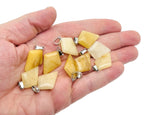 Yellow jade triangle gemstone pendant with geometric design, showcasing a vibrant yellow jade stone on a silver chain.