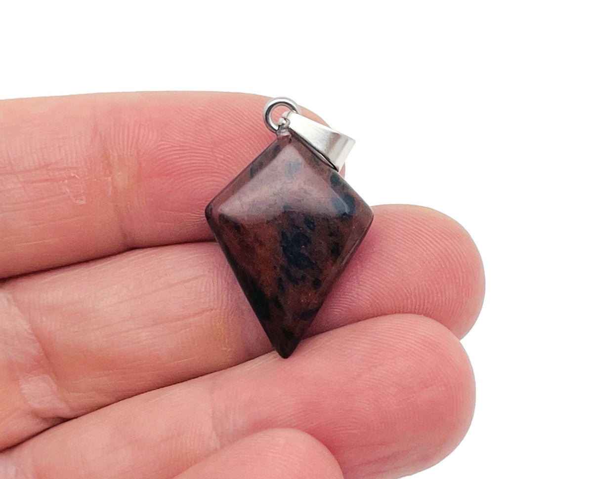 Mahogany Obsidian triangle gemstone pendant with geometric design, showcasing deep reddish-brown and black polished stone.