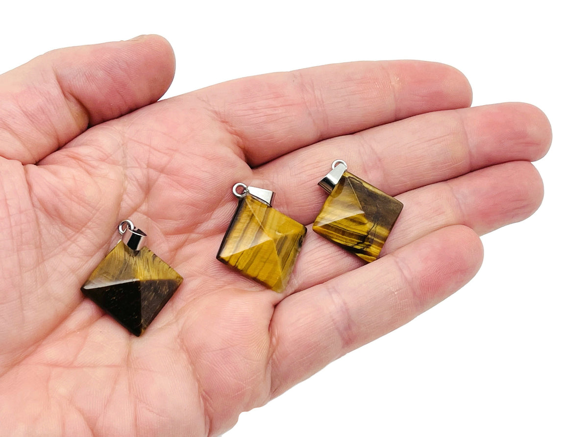 Tiger Eye pyramid gemstone pendant from GemstoneGO featuring natural tiger eye stone and intricate pyramid shape.