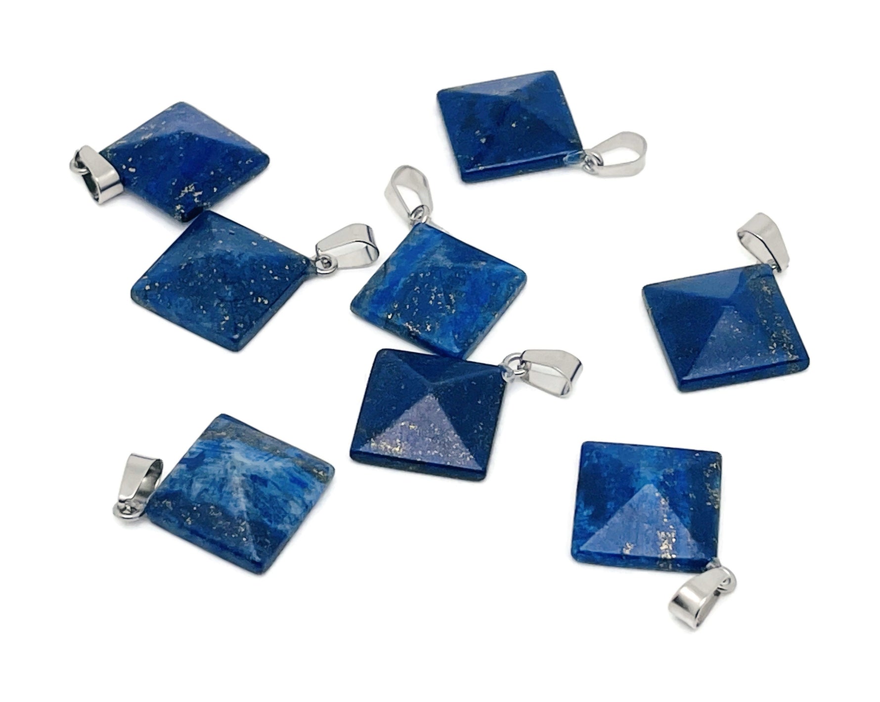 Lapis Lazuli pyramid gemstone pendant from GemstoneGO, showcasing a deep blue natural gemstone with gold flecks on a silver chain.