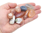 Crimson Agate tumbled gemstone from GemstoneGO showcasing deep red, polished stone with smooth, rounded surface for jewelry or collection.