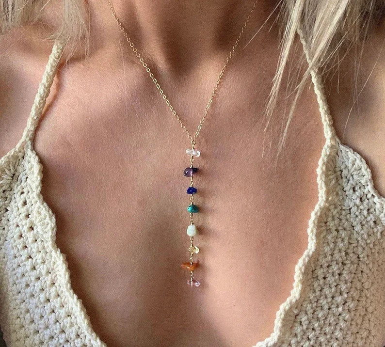 Seven Chakra crystal necklace with silver and gold accents, featuring colorful gemstone beads for spiritual balance and style.