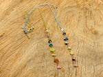 Silver and gold 7 chakra crystal necklace with colorful gemstone beads, designed by GemstoneGO for balanced energy.