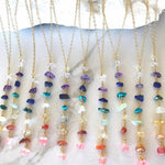 7 Chakra crystal necklace with silver and gold accents, featuring colorful gemstones representing each chakra, gemstoneGO jewelry