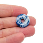 Blue Spot Jasper crystal donut from GemstoneGO, 20mm Pi Stone featuring vibrant blue spots and polished gemstone finish.