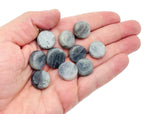 Round Labradorite flat gemstone slab from GemstoneGO showcasing iridescent blue and green flash, smooth polished surface, and natural stone patterns.