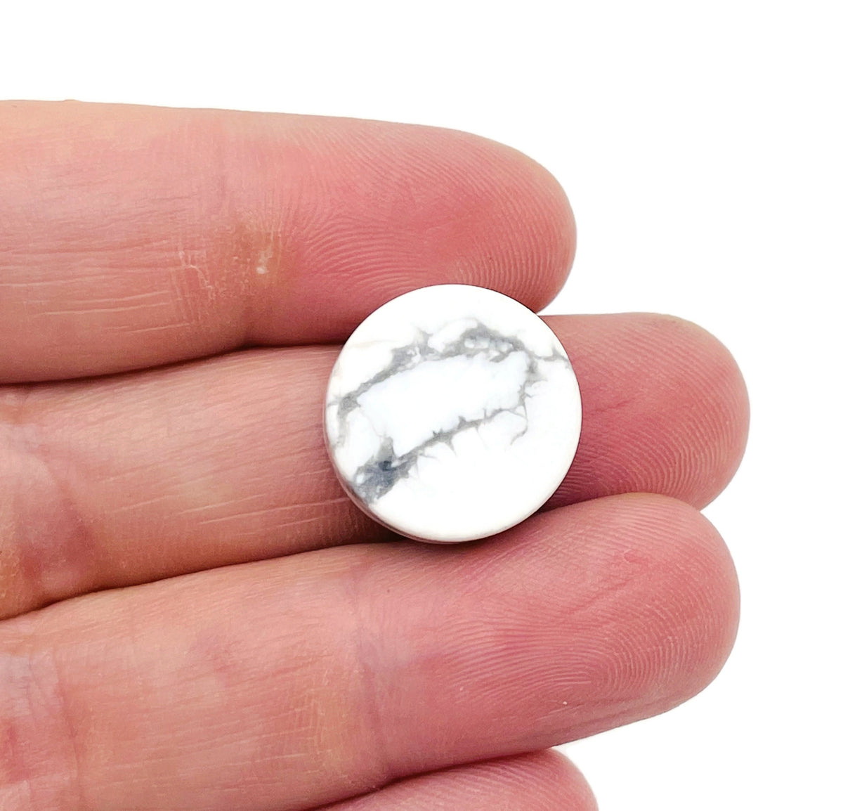 Rountd Howlite flat gemstone slab from GemstoneGO, showcasing smooth, polished white and gray veined crystal surface.