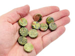 Round Unakite flat gemstone slab with natural green and pink hues, showcasing its smooth polished surface and unique mineral patterns.