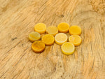 Round yellow jade flat gemstone slab from GemstoneGO, showcasing smooth, polished yellow jade crystal with natural variations.