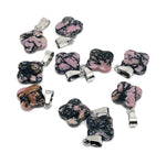 Rhodonite four-leaf clover crystal pendant from GemstoneGO for DIY jewelry making, featuring pink and black gemstone details.