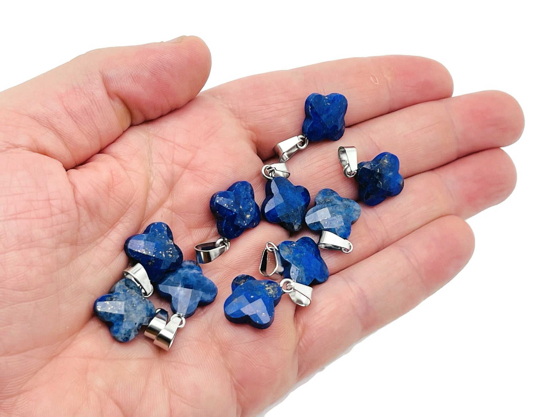 Lapis Lazuli four-leaf clover crystal pendant for DIY jewelry making, featuring vibrant blue gemstone and silver bail.