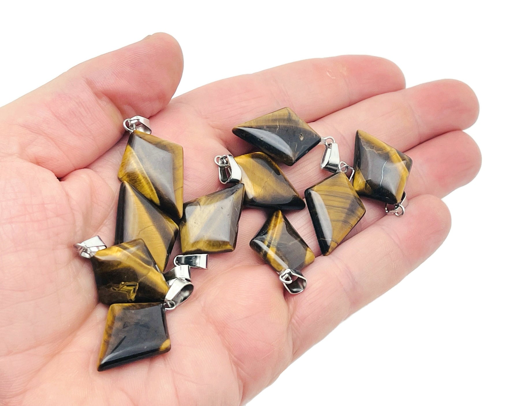 Tiger Eye triangle gemstone pendant featuring a geometric design, crafted by GemstoneGO, showcasing warm, rich earthy tones.