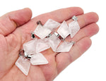 Clear quartz triangle gemstone pendant from GemstoneGO, featuring a geometric design and polished surface.