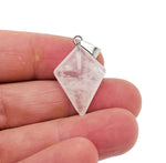 Clear quartz triangle gemstone pendant with geometric design, showcasing a polished, transparent crystal from GemstoneGO.
