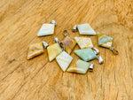 Amazonite triangle gemstone pendant from GemstoneGO, featuring a geometric design with a polished blue-green mineral surface.