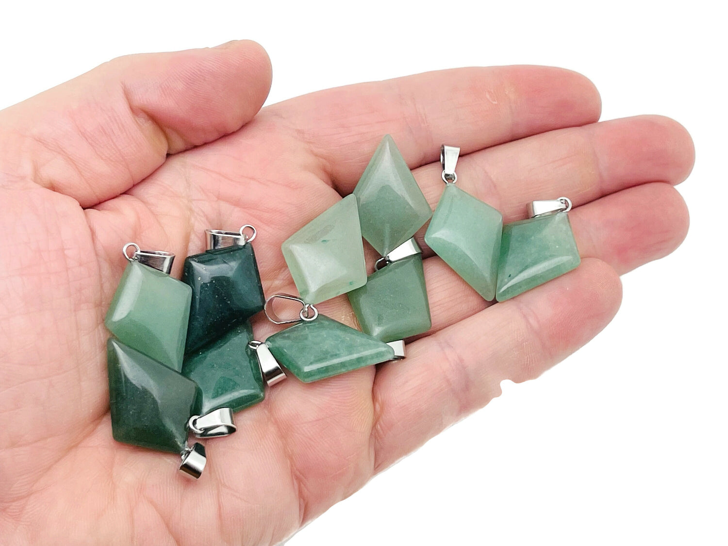 Aventurine triangle gemstone pendant with geometric design, showcasing vibrant green color and polished surface, from GemstoneGO.