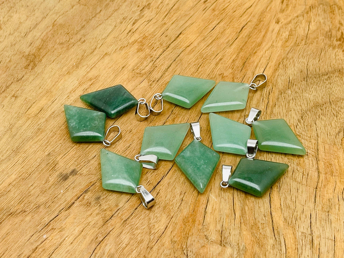 Aventurine triangle gemstone pendant with geometric design, featuring vibrant green aventurine stone on a silver chain.