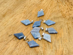 Blue aventurine pyramid gemstone pendant from GemstoneGO, showcasing a natural blue gemstone carved into a pyramid shape.