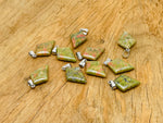 Unakite triangle gemstone pendant with geometric design, featuring vibrant green and pink hues, by GemstoneGO.