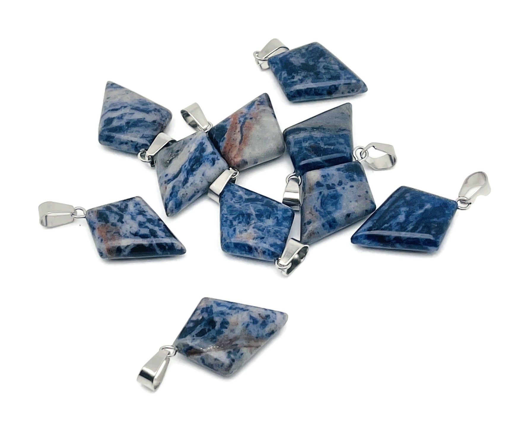 Sodalite triangle gemstone pendant from GemstoneGO featuring a geometric design, showcasing blue and white mineral patterns.