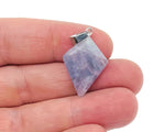 Fluorite triangle gemstone pendant with geometric design, showcasing vibrant colors and polished surface, from GemstoneGO.