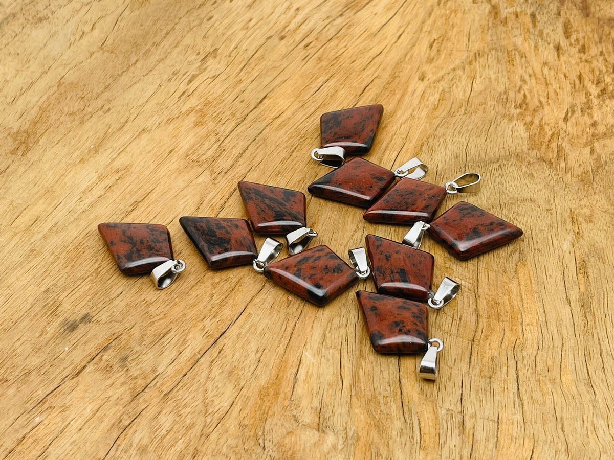 Mahogany Obsidian triangle gemstone pendant with geometric design, crafted by GemstoneGO, showcasing polished stone and silver bail.