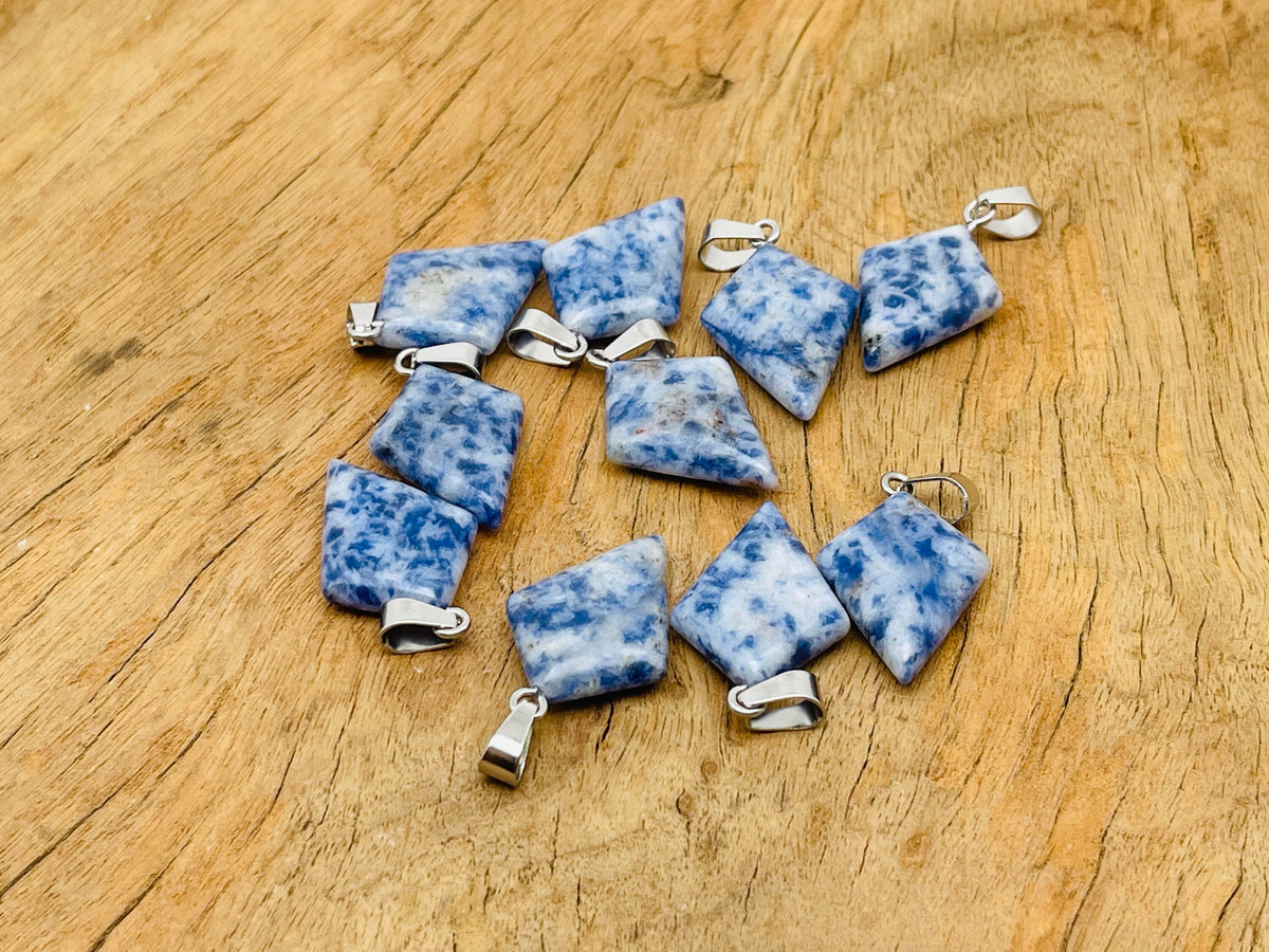 Blue Spot Jasper triangle gemstone pendant featuring a geometric design, crafted by GemstoneGO.